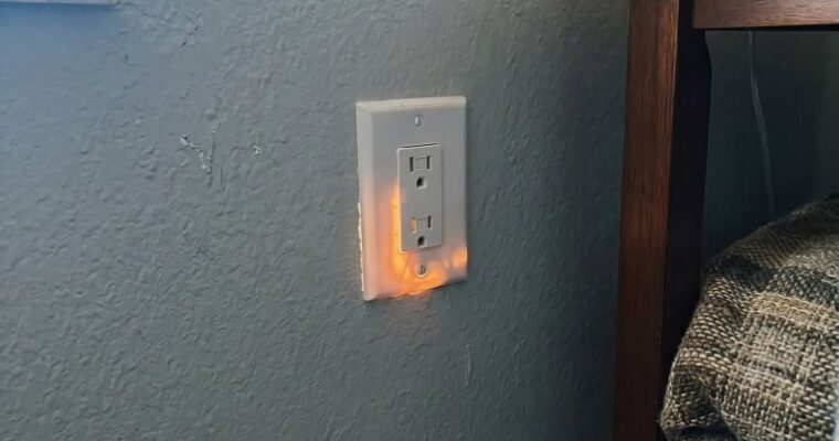 Why Is This Electrical Outlet Glowing Orange? The Warning You Should Never Ignore