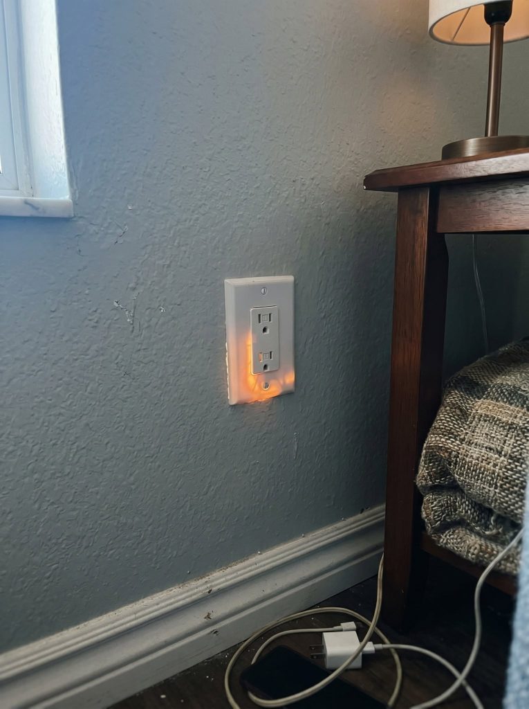 Why Is This Electrical Outlet Glowing Orange? The Warning You Should Never Ignore