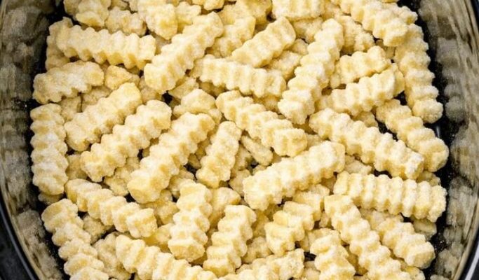 Dump frozen crinkle-cut fries in the slow cooker and 3 other ingredients to get a meal so delicious your Memorial Day guests will be begging for more!