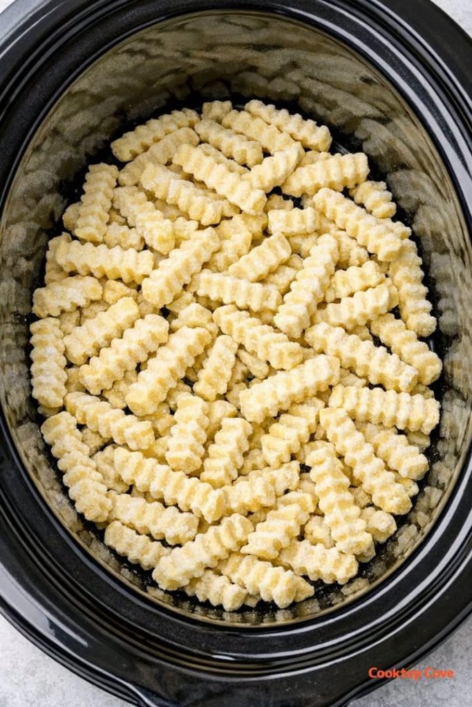 Dump frozen crinkle-cut fries in the slow cooker and 3 other ingredients to get a meal so delicious your Memorial Day guests will be begging for more!