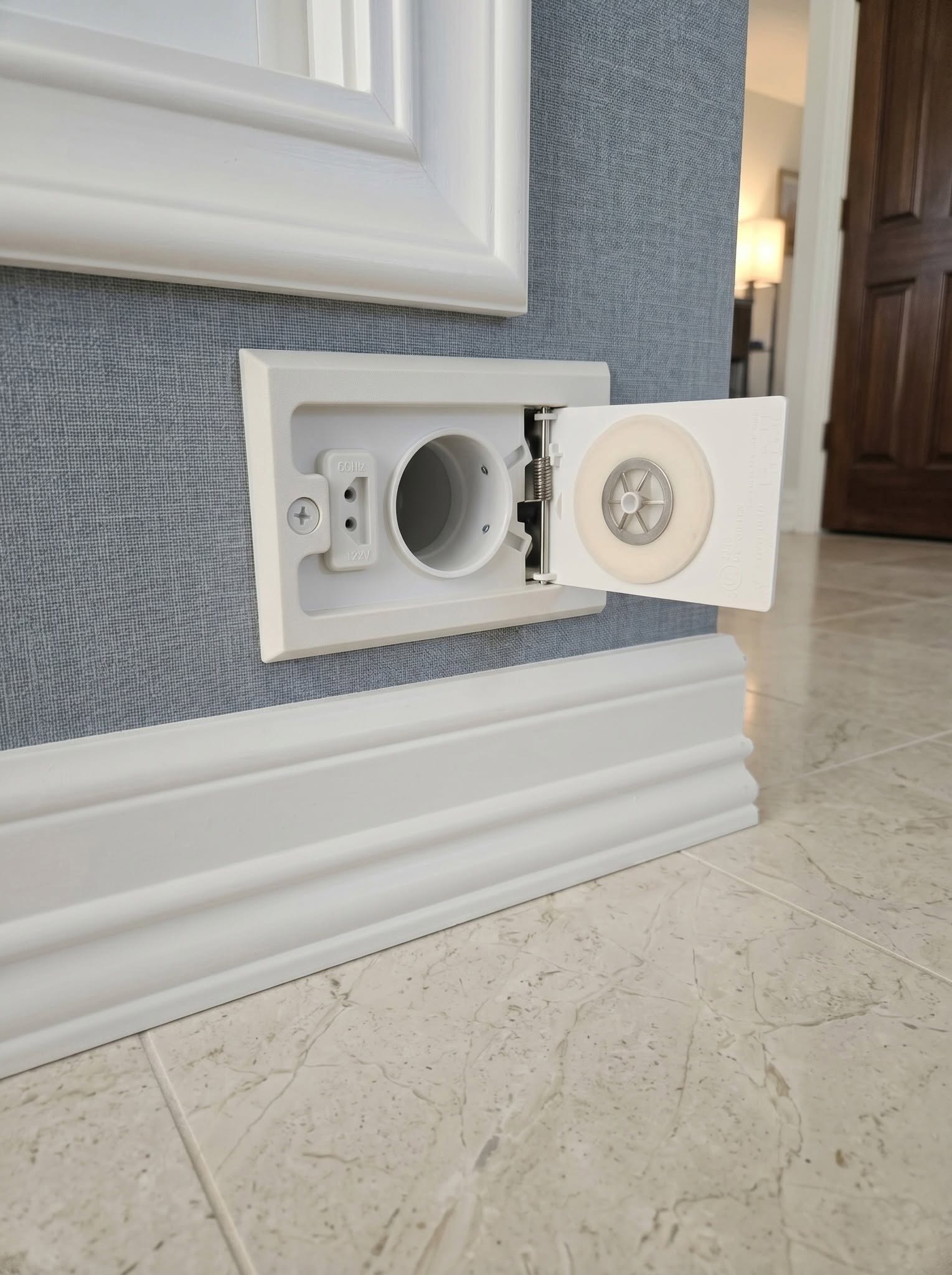 What is this strange electrical outlet near the floor? The surprising explanation.