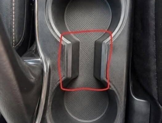 What Is the Weird Gap Between Car Cup Holders For? (And Why It’s Actually Brilliant)