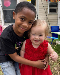 My 8 Year Old Son Gave Up His Lunch Money to Buy a Little Girl with Down Syndrome a Red Birthday Dress The Next Morning, Our Lawn Was Covered with Lunchboxes, but What Was Inside the Biggest One Made Him Go Pale